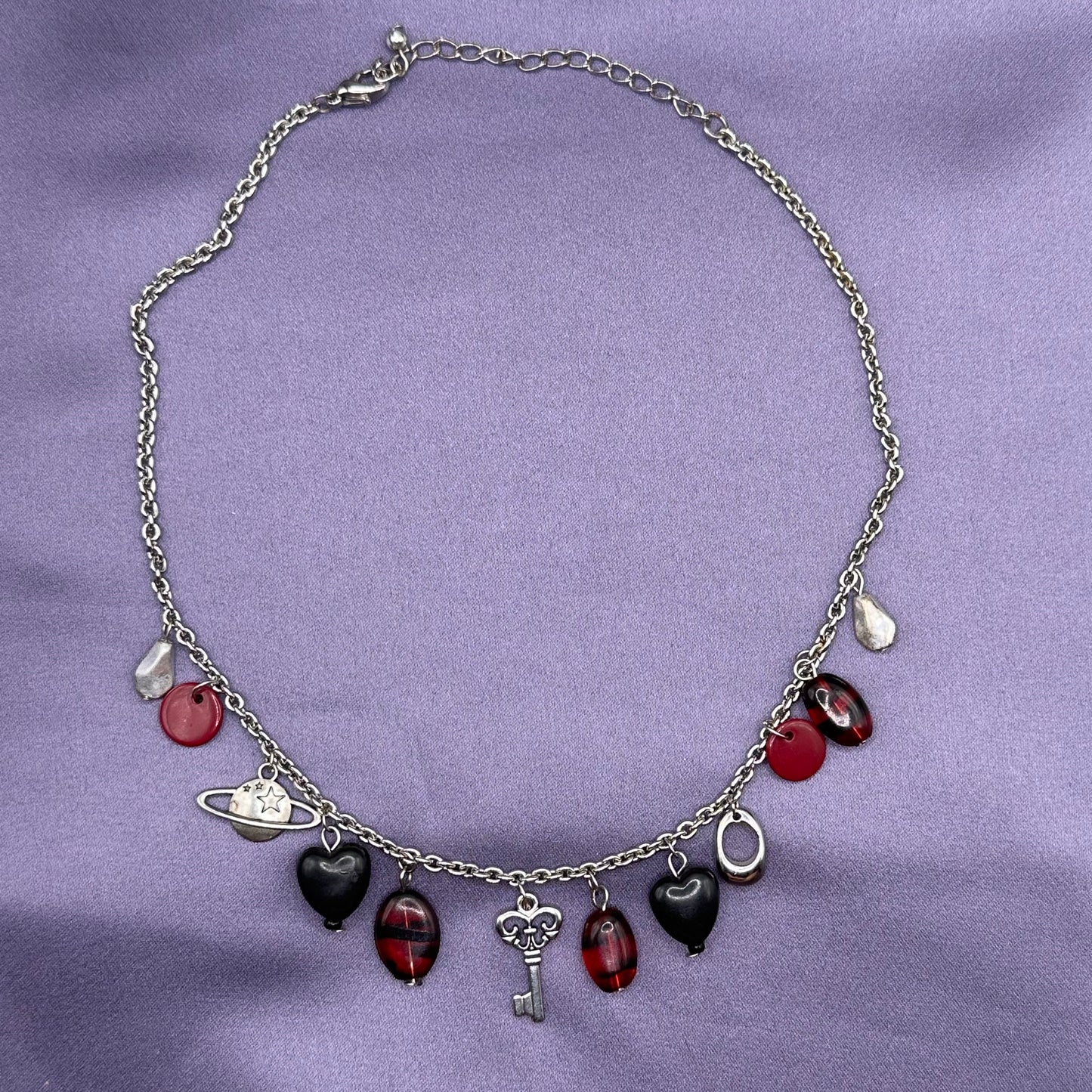 red and black charm necklace
